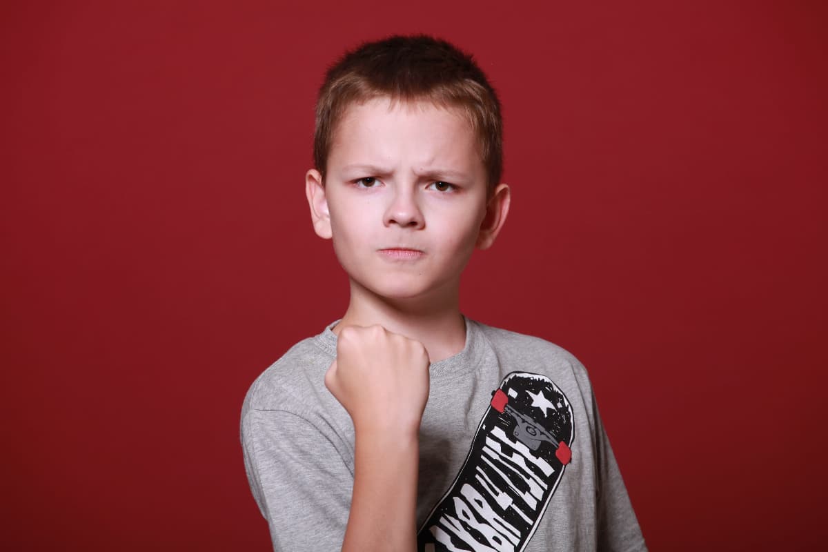 How To Look Cool Wearing A Skateboard Helmet 1 Angry boy with clenched fist