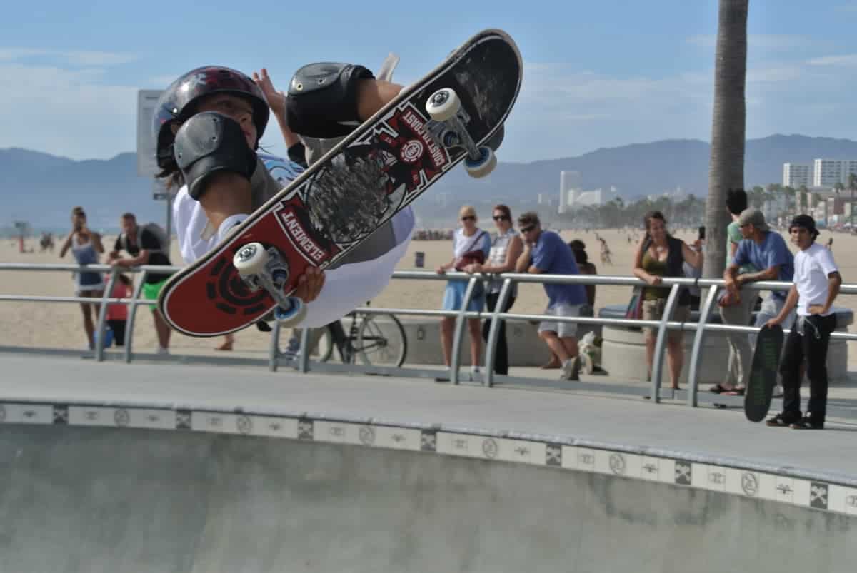 Young skateboarder sideways