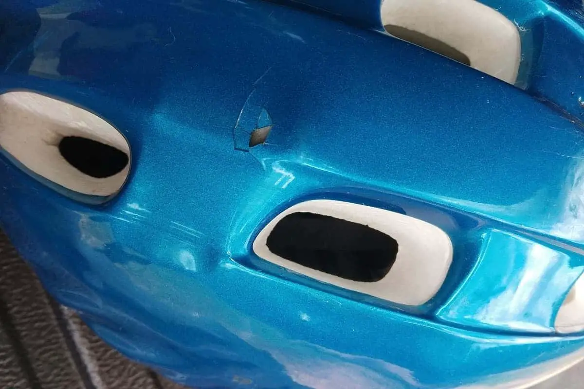 Damaged blue bike helmet