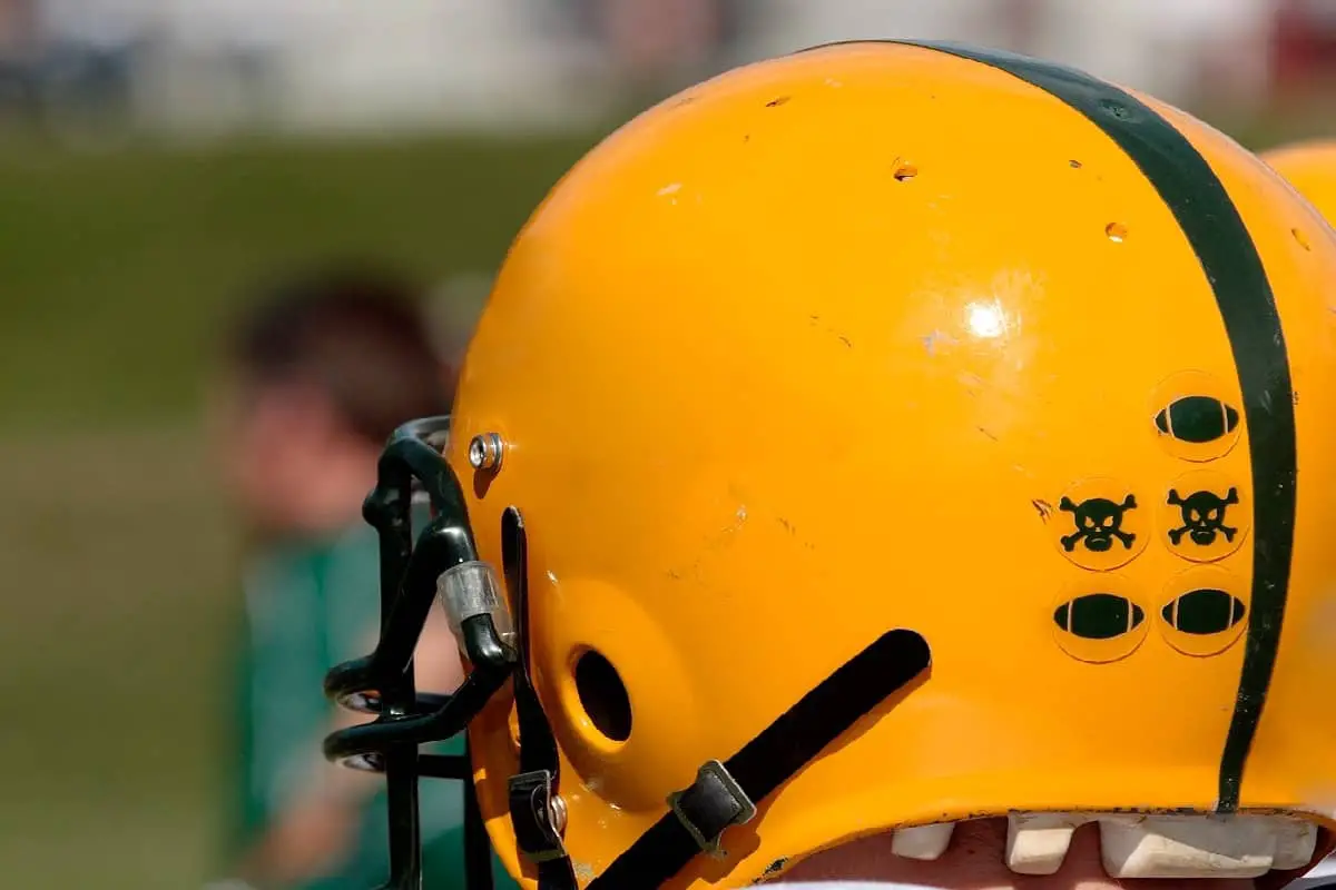 Stickers on college football helmets, like skull and cross bone stickers. What does it mean?