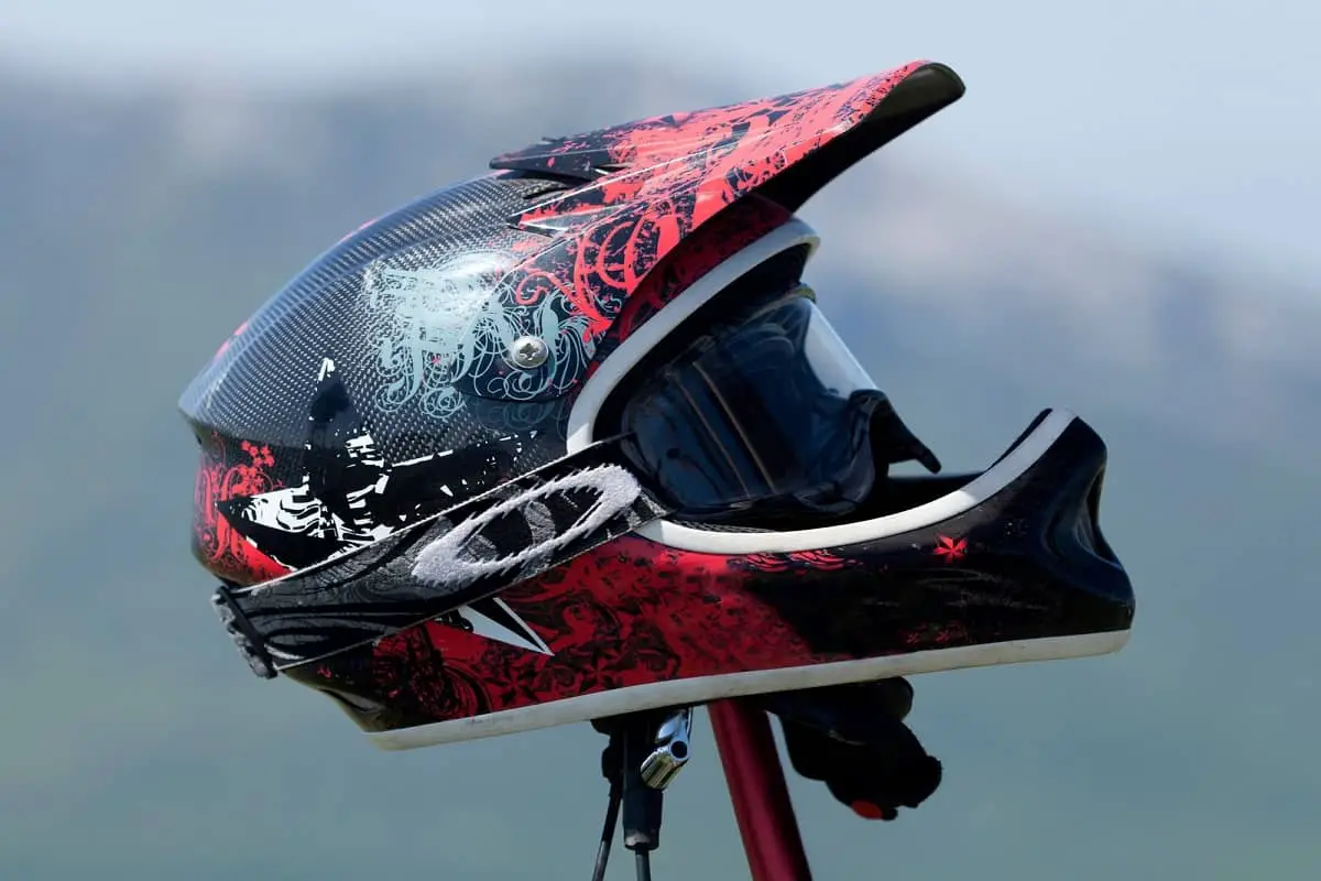 Why Do Mountain Bike Helmets Have Visors? 5 Red Full-Face mountain bike helmet with goggles.