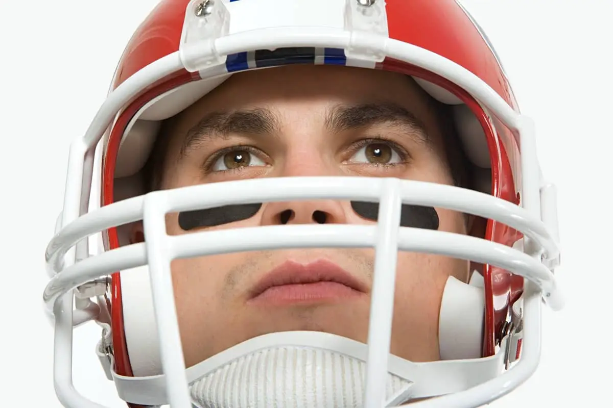 Best Youth Football Helmet 2023 1 Young American football player wearing the best youth football helmet