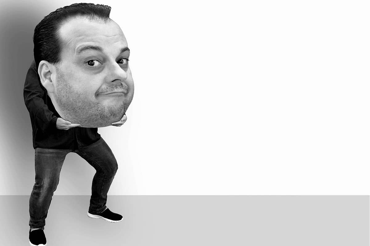 Man holding his big head