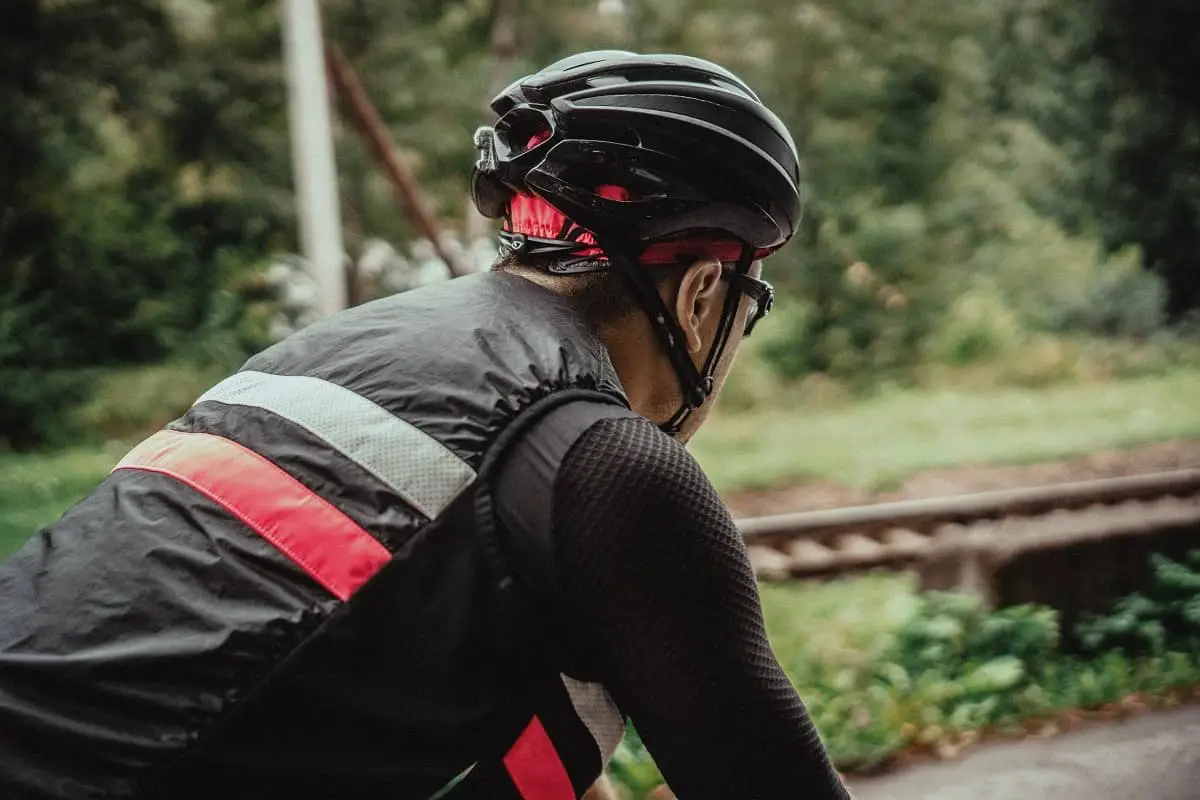 Male cyclist wearing a black helmet