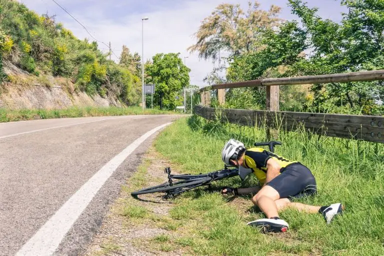 Bicycle and cyclist crashed on side of country road