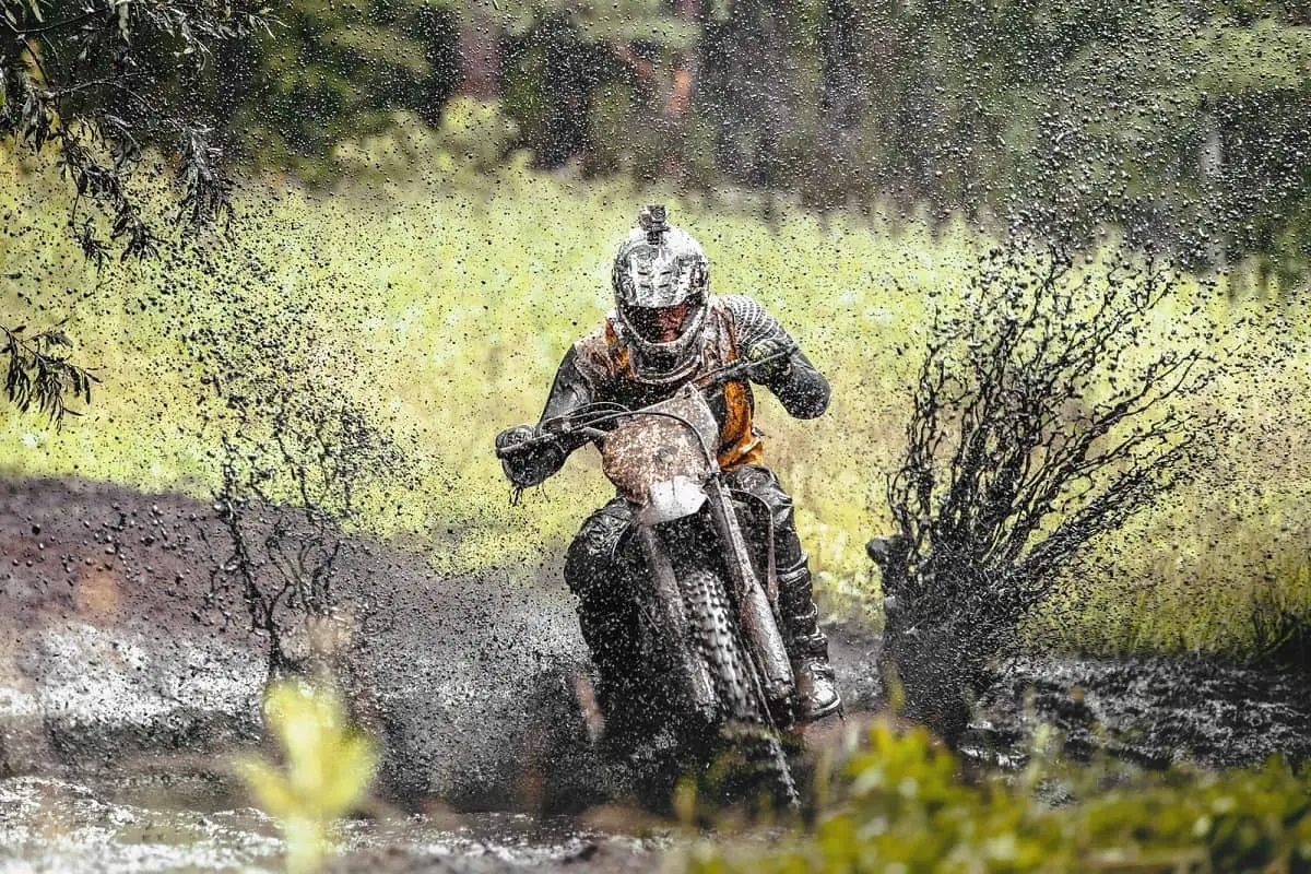 Why do dirt bike helmets have visors? 
They can be useful when dirt biking through a muddy trail like this one.