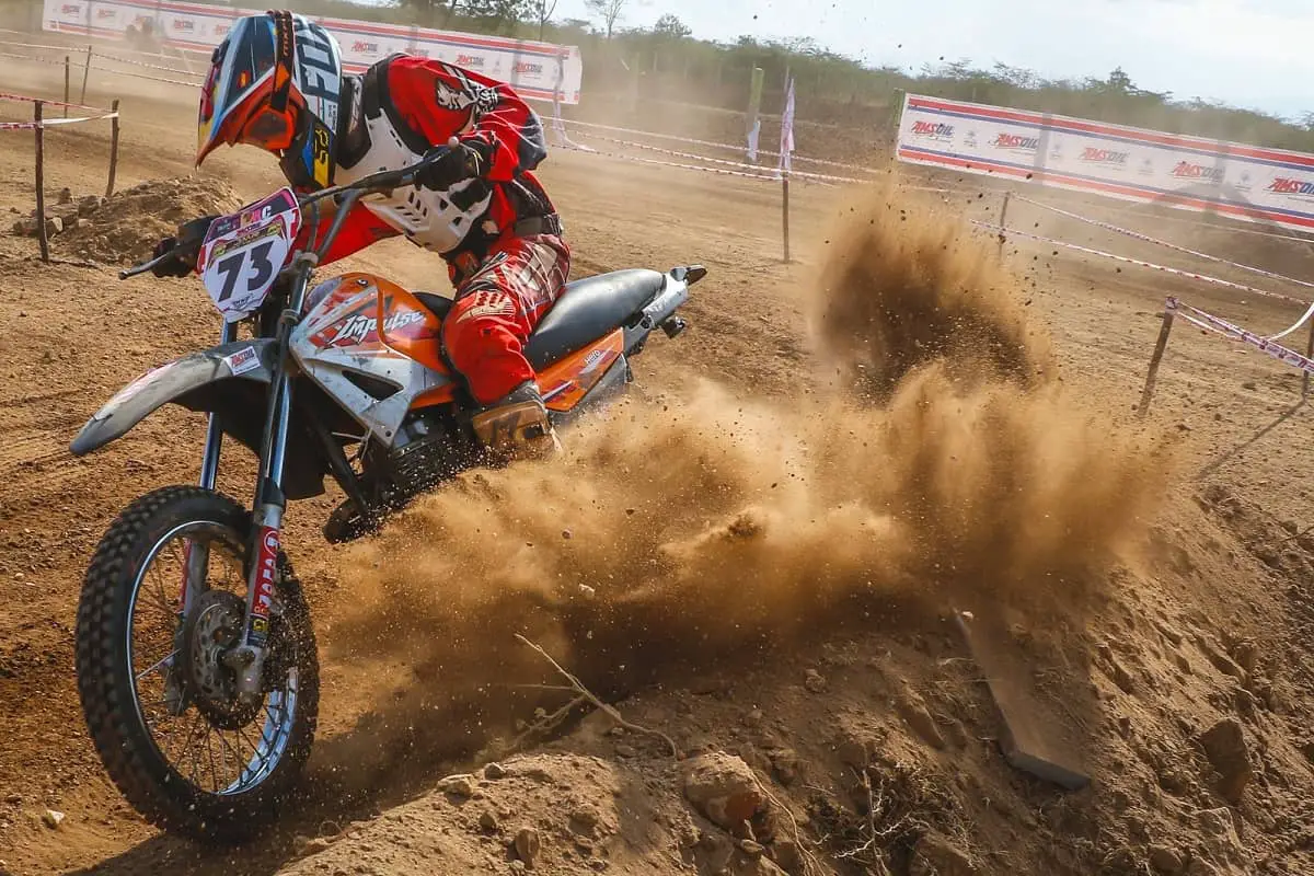 Dirt bike kicking up some roost