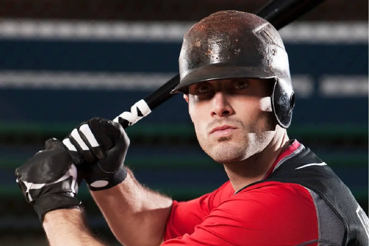 Baseball batter wearing helmet covered with pine tar