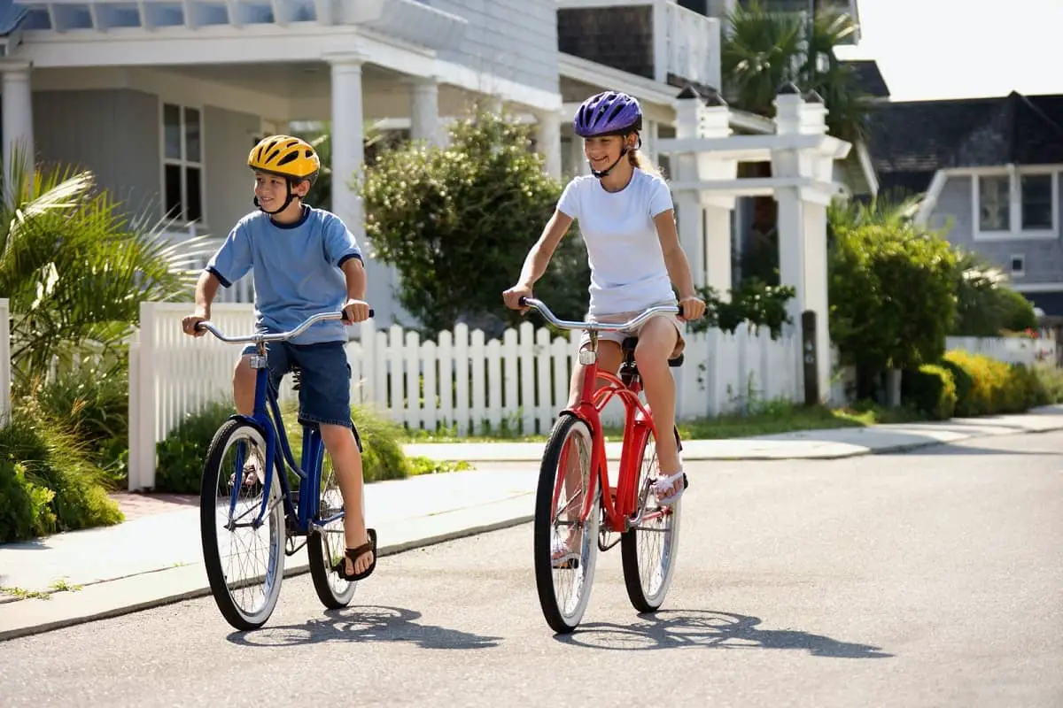 Do Bike Helmets Expire? 2 Two teenagers riding bikes wearing helmets. How long will their helmets last?