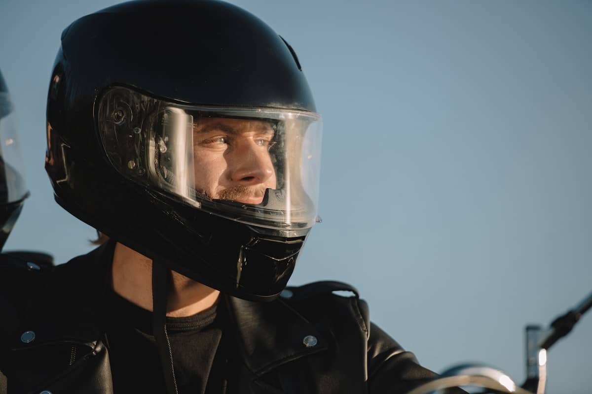 man wearing black motorcycle helmet