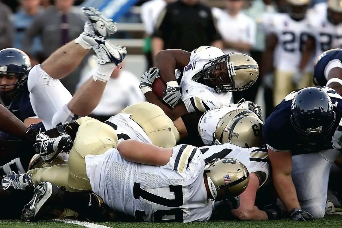pile up of football players during a game