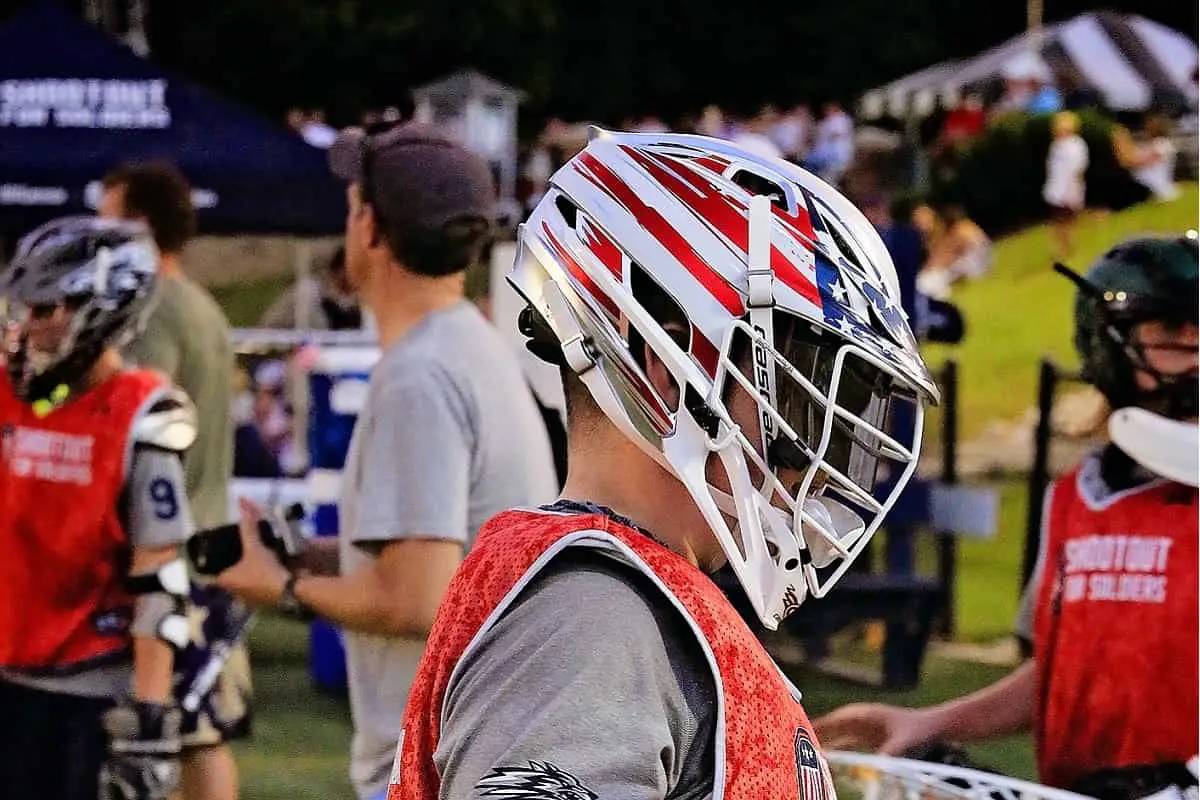 Lacrosse helmet visor rules can be confusing.  Good thing that this lacrosse player is wearing his lacrosse helmet with visor.