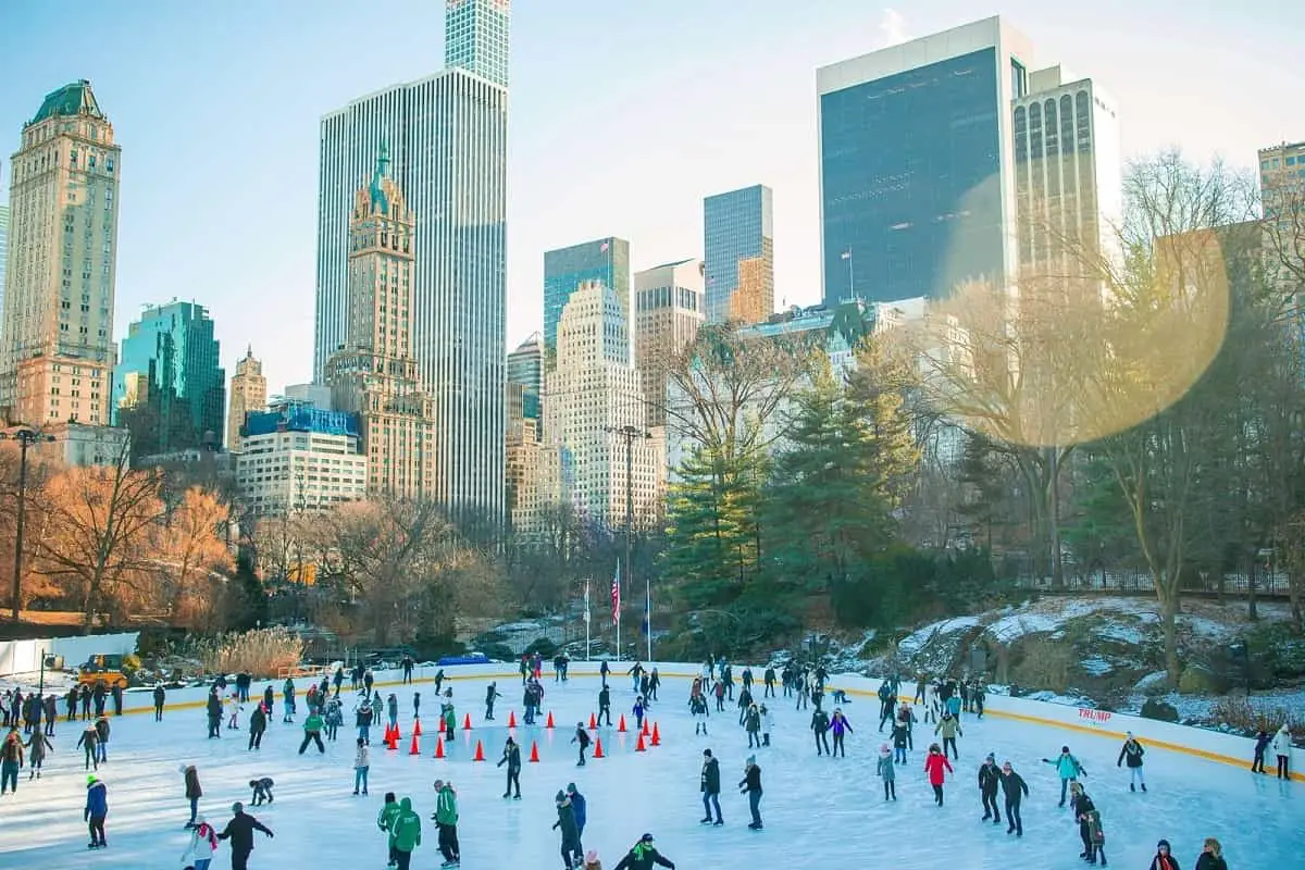 lots of people ice skating in New York's Central Park