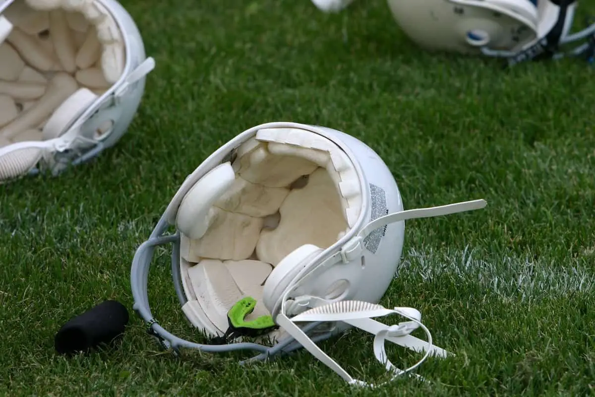interior of white football helmet showing white padding in the helmet