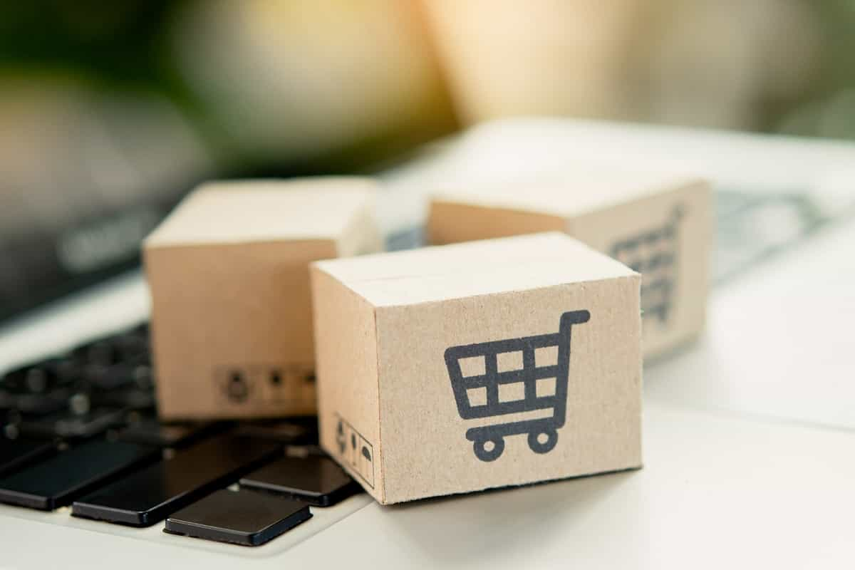 miniature cardboard box with mini shopping cart printed on the side