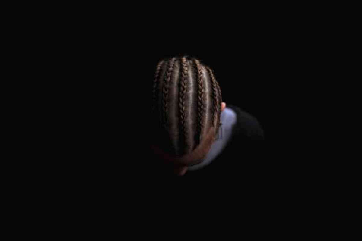 top down view of man's hair platted in corn rows