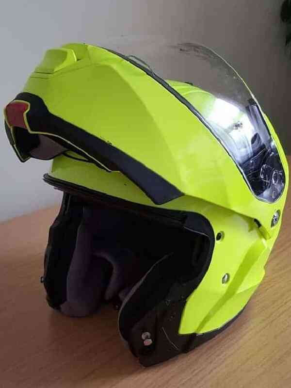 Yellow modular motorcycle helmet with the front bar up