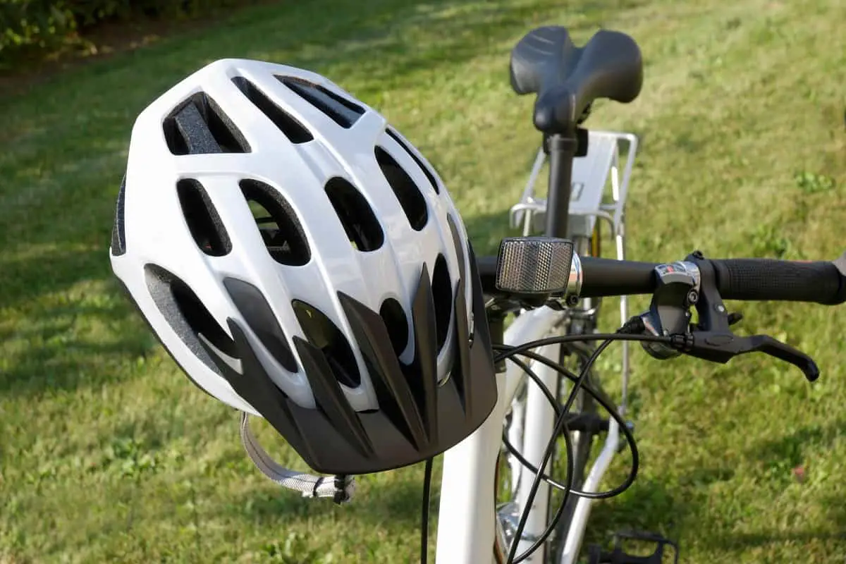 Why Do Bike Helmets Have Holes? 1 Why do bike helmets have holes, like this white bike helmet sitting on the handle bar of a white bicycle.