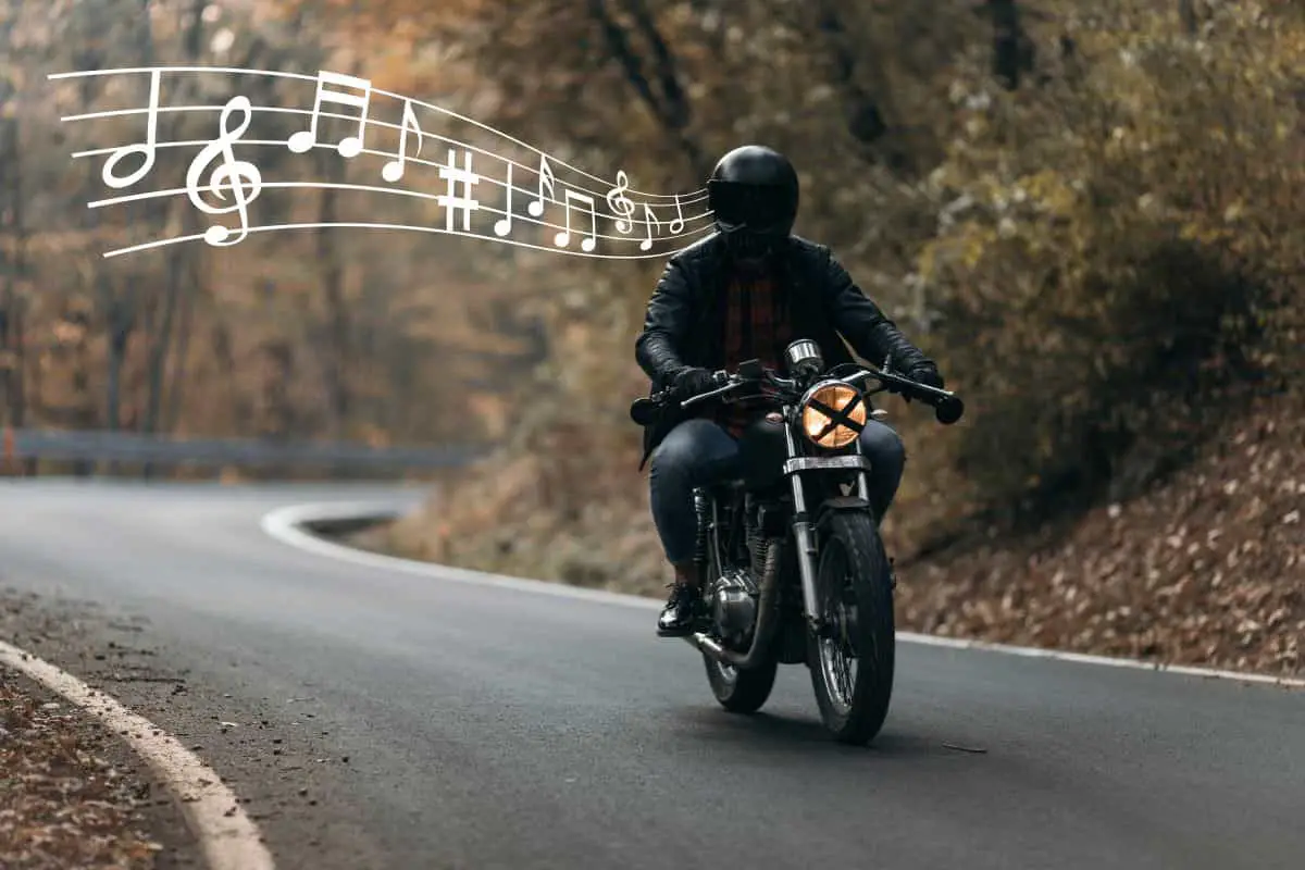 Can You Listen to Music with a Bluetooth Motorcycle Helmet? 4 Person riding a motorcycle while listening to music.