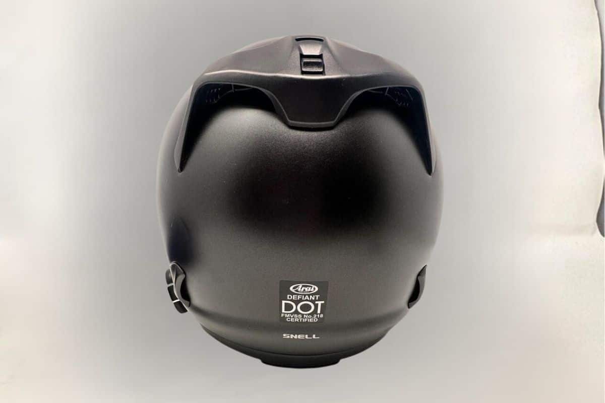 Rear view of Arai Defiant motorcycle helmet showing SNELL certified.