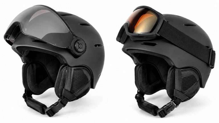 Matte black ski helmet with integrated visor beside ski helmet with separate goggles on a white background.